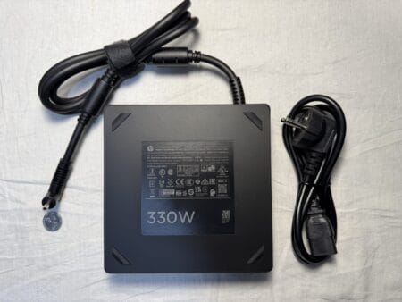 HP laptop charger 330W 19.5V 16.92A 4.5×3.0mm, including a C13 power cable. - Front side, showing the sticker. 